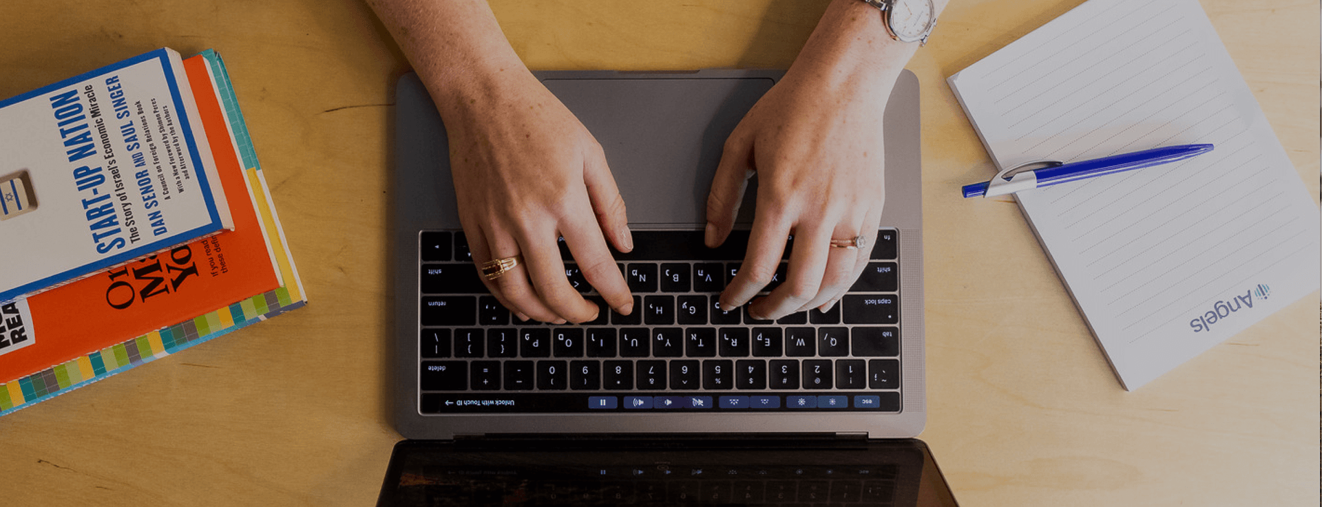 woman hands working on a laptop top view
