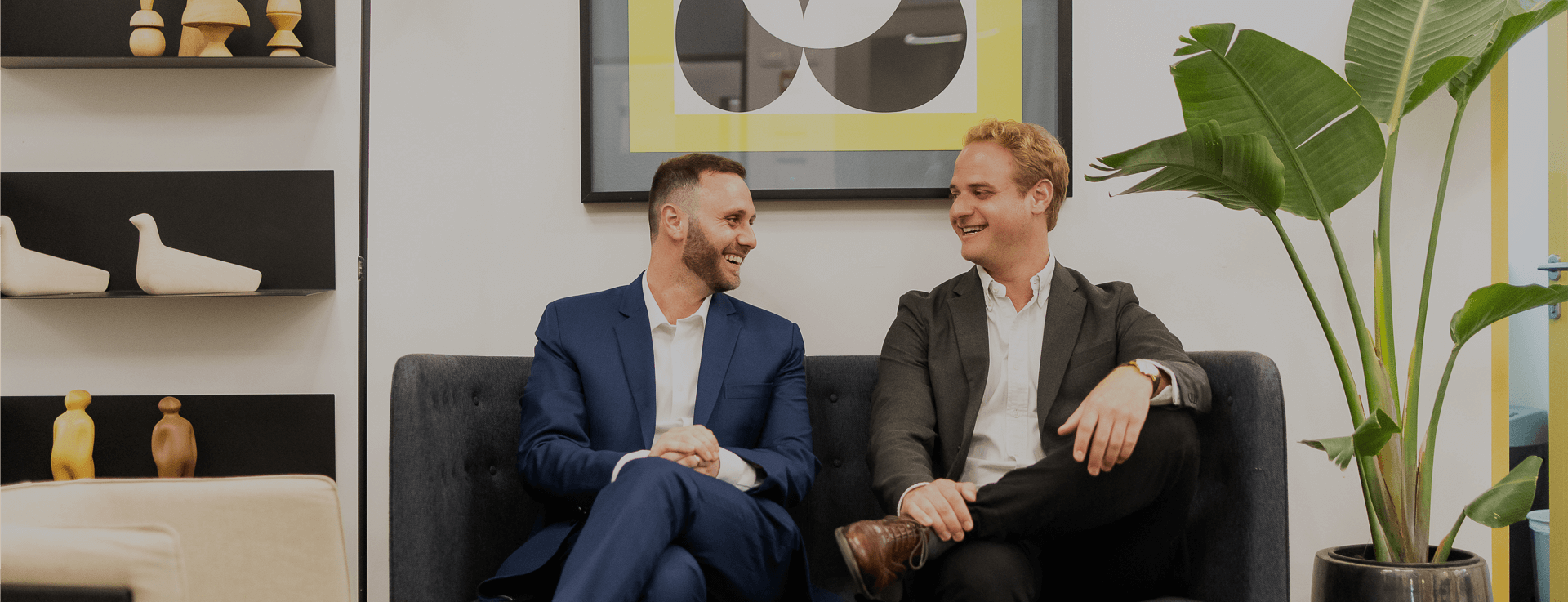 two business man siting on a sofa